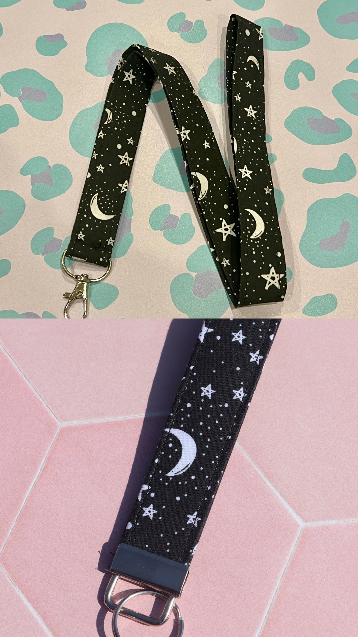Black lanyard with star and moon pattern on a pink and green patterned background