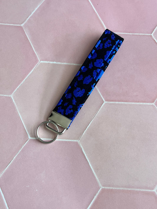 Sew Much Love black and blue metallic leopard print wristlet keychain with silver clasp.