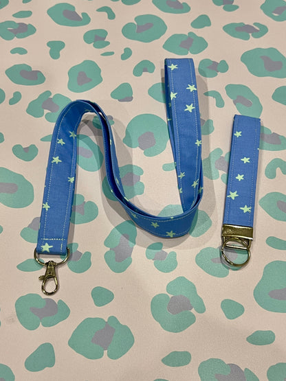 Blue lanyard with star pattern on a patterned background