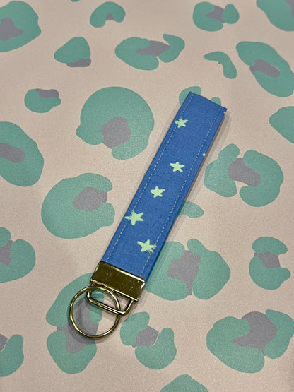 Sew Much Love blue and mint green starry fabric wristlet keychain with silver hardware.