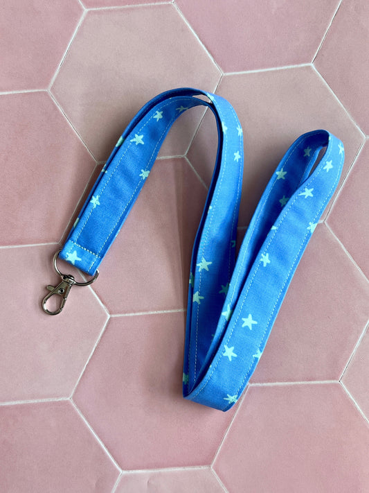 Sew Much Love blue and mint green starry fabric lanyard with D-ring and swivel clasp for keys and ID badges.