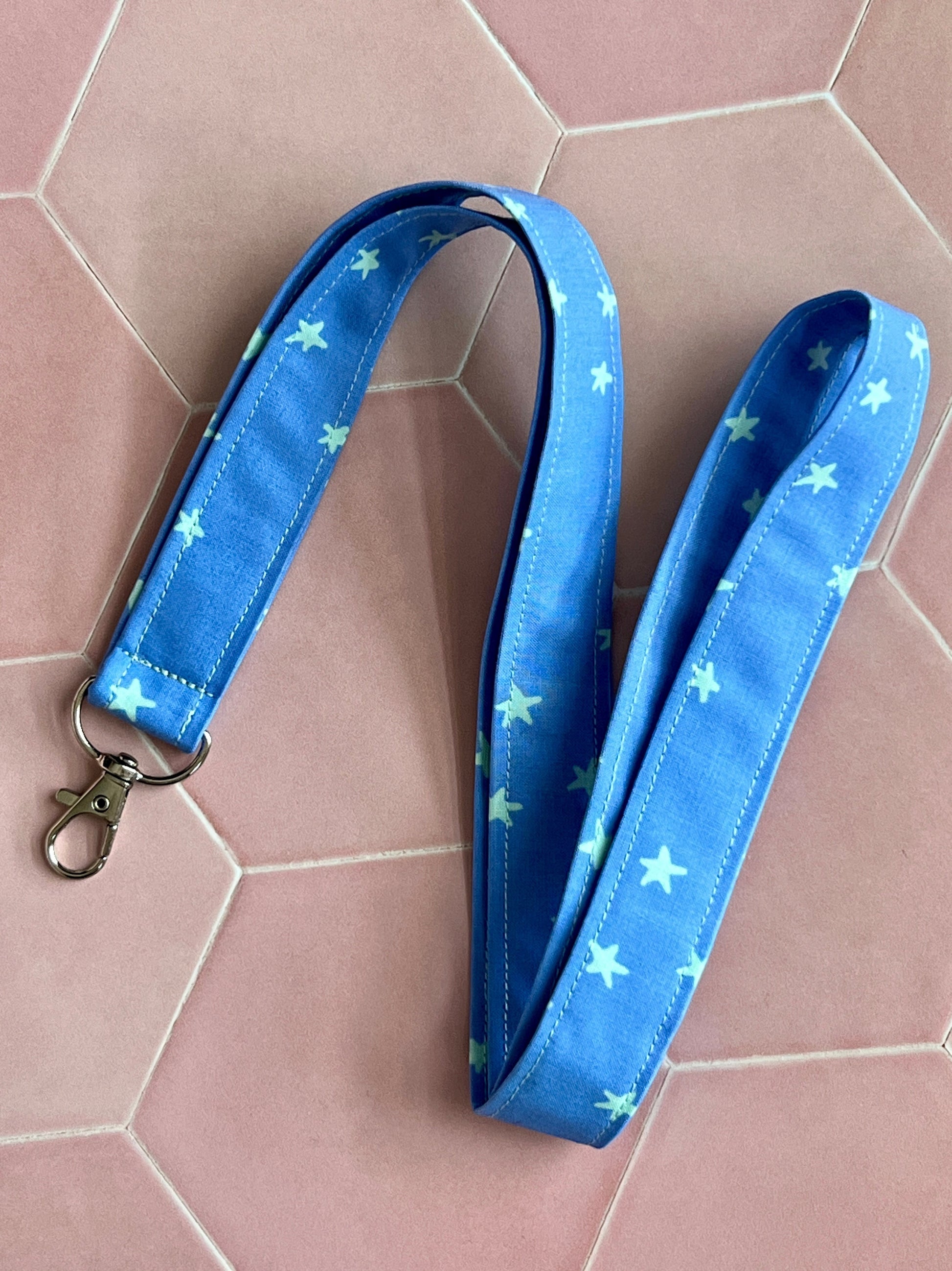 Sew Much Love blue fabric lanyard with mint green stars and silver D-ring, perfect for keys and ID badges.