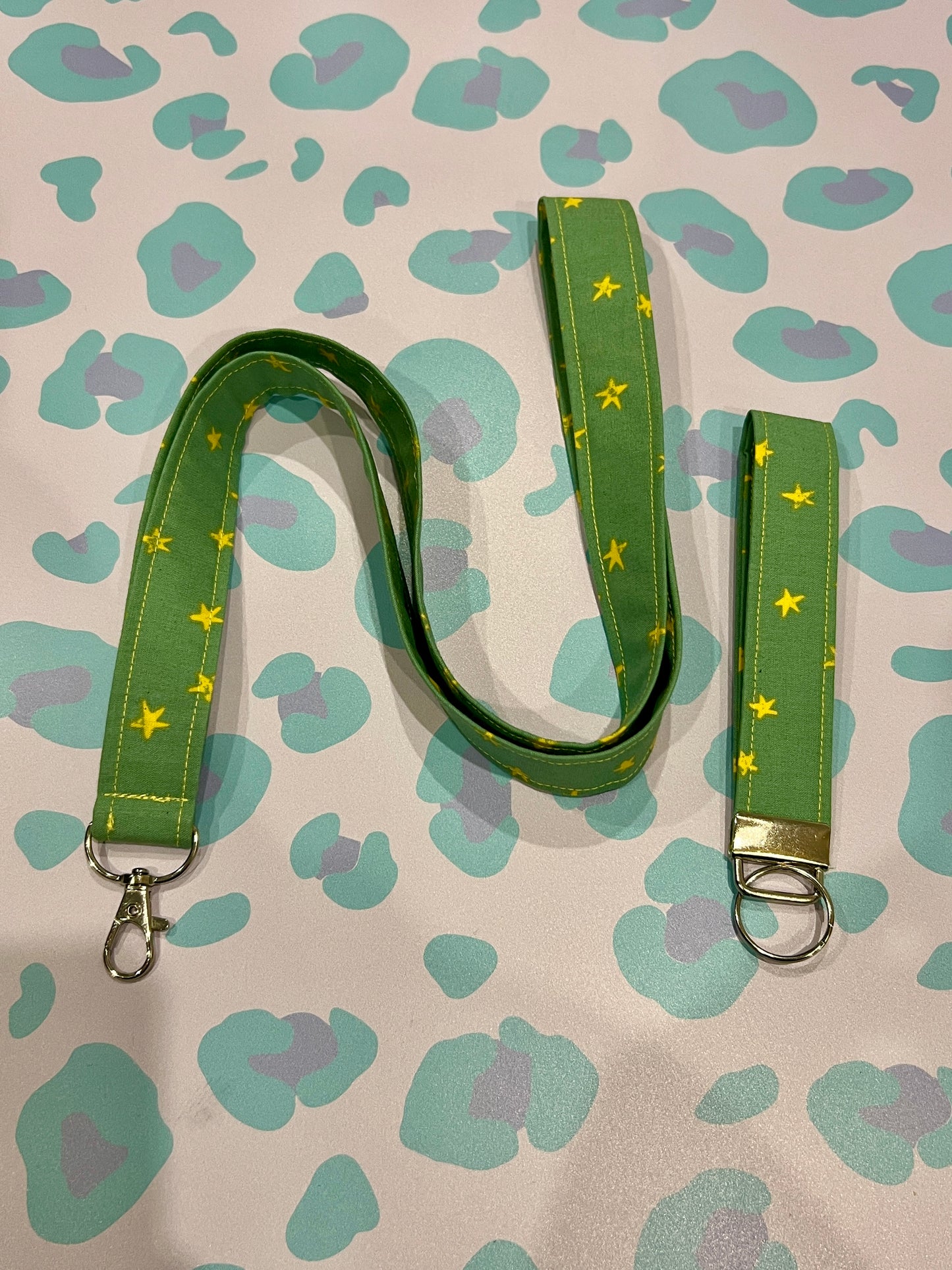 Green lanyard with star pattern on a patterned background