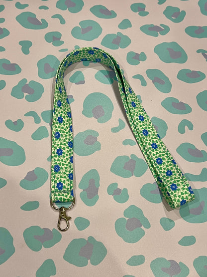 Sew Much Love Liberty blue floral and green leaf print lanyard with silver clasp.