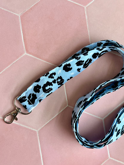 Close-up of handmade light blue leopard print lanyard, perfect for carrying keys, badges, and wallets securely