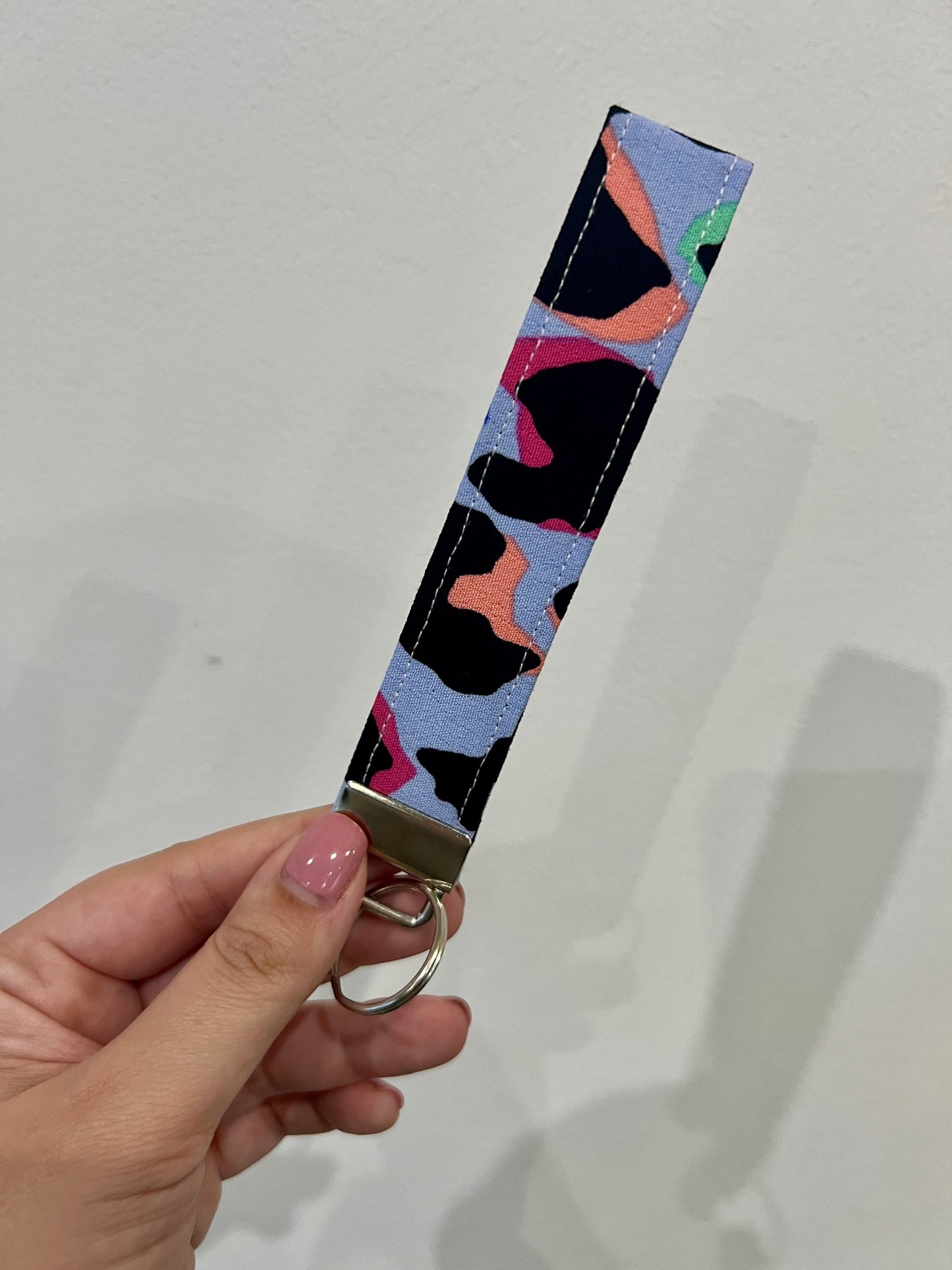 Sew Much Love light blue wristlet keychain with rainbow leopard print, cotton fabric, and silver hardware.