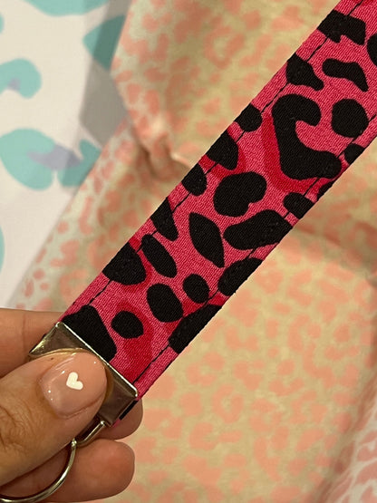 Sew Much Love pink and black wild leopard print fabric wristlet keychain with silver hardware.