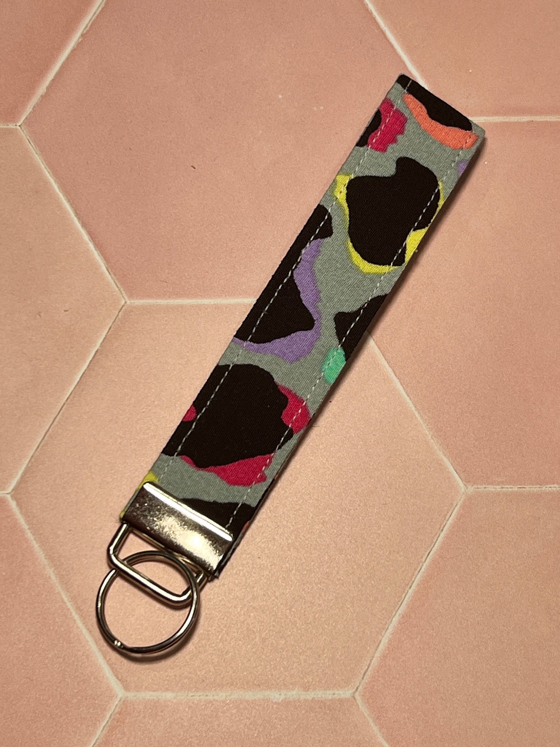 Sew Much Love khaki cotton wristlet keychain with rainbow leopard print and silver hardware.