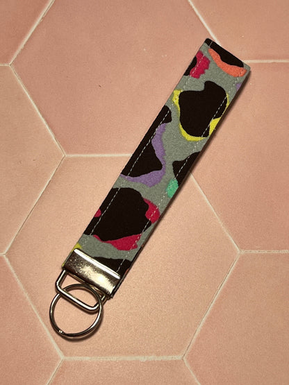Sew Much Love khaki cotton wristlet keychain with rainbow leopard print and silver hardware.