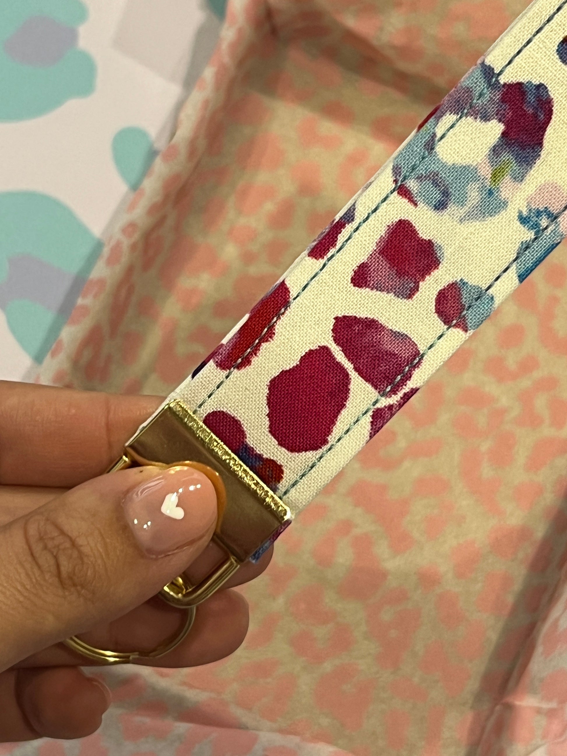 Sew Much Love rainbow tie-dye leopard print cotton wristlet with gold hardware and keyring.