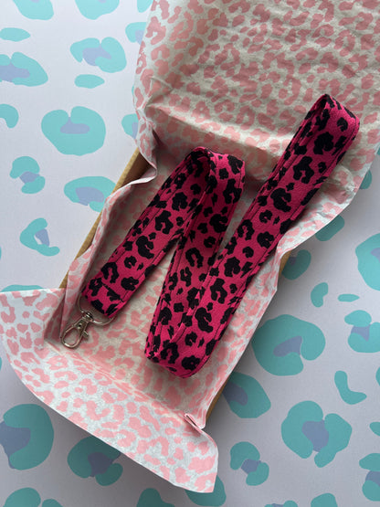 Sew Much Love raspberry pink and black leopard print fabric lanyard with D-ring and swivel clasp.