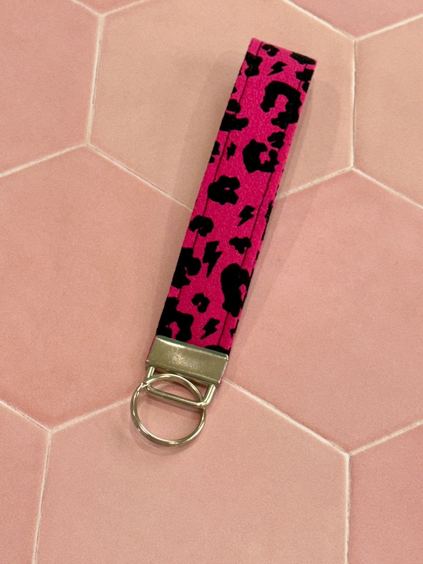Sew Much Love raspberry pink leopard print fabric wristlet keychain with silver hardware.