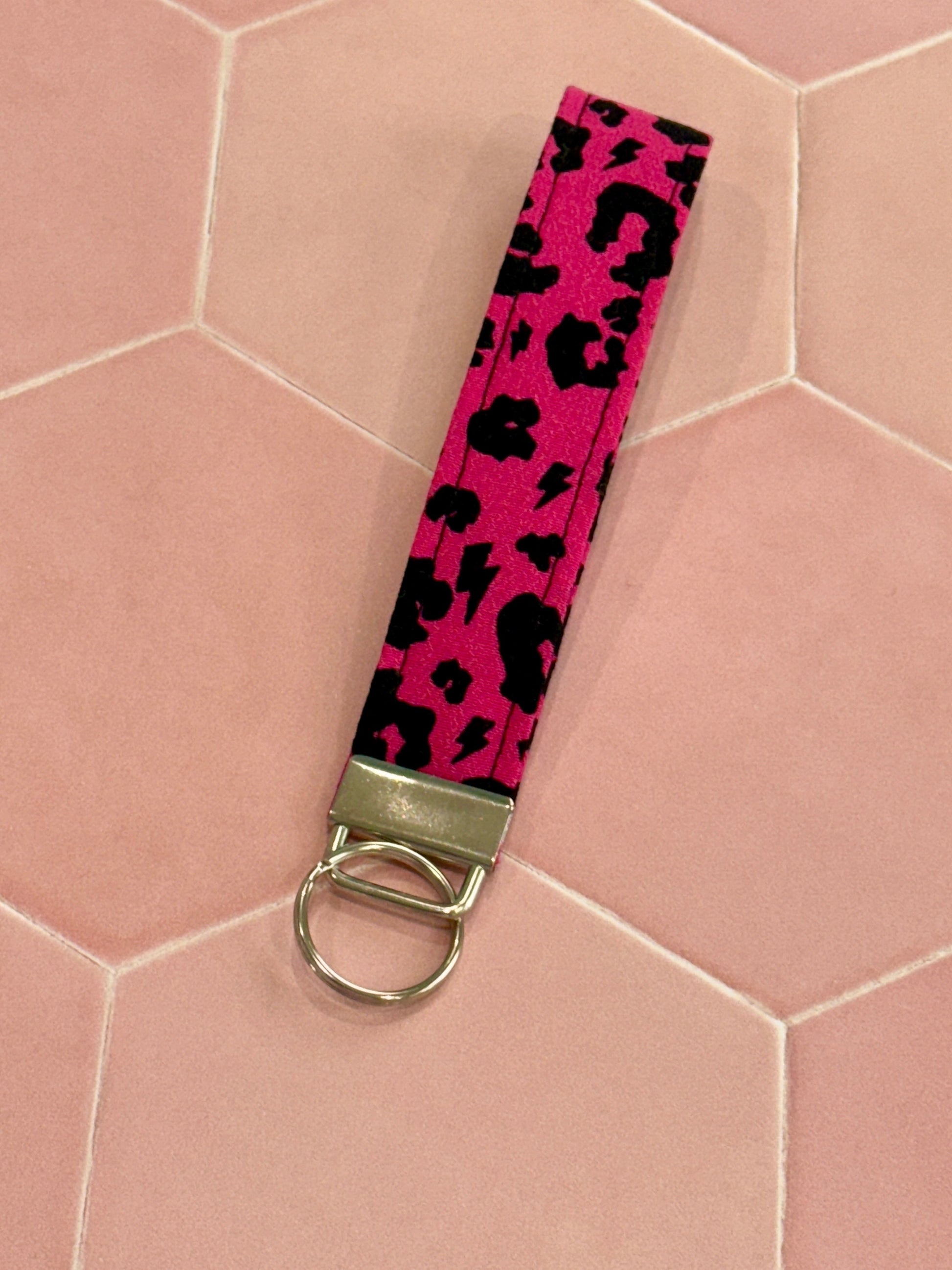 Sew Much Love raspberry pink leopard print fabric wristlet keychain with silver hardware.