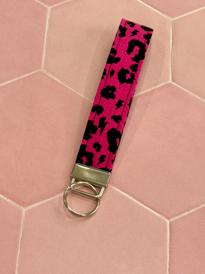 Sew Much Love raspberry pink leopard print fabric wristlet keychain with silver hardware.