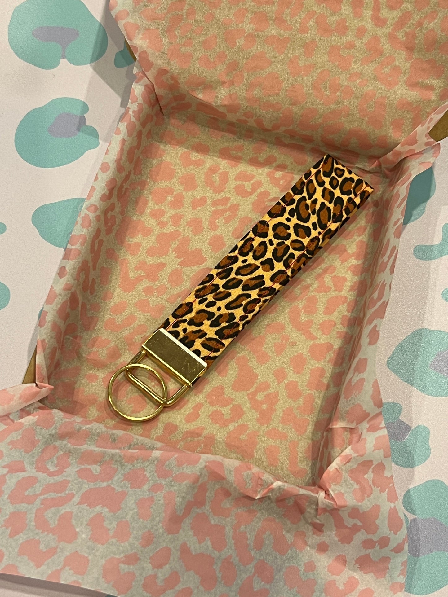 Sew Much Love classic leopard print cotton wristlet keychain with gold hardware.
