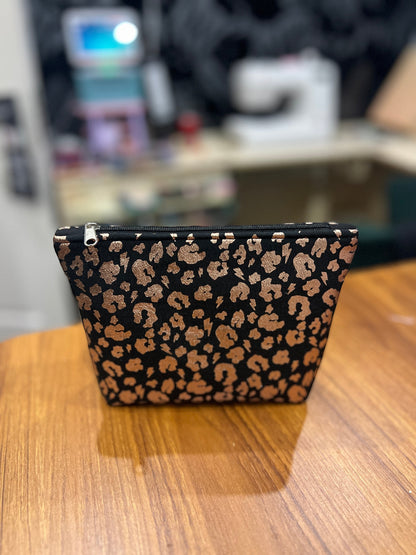 Sew Much Love black eco viscose mini cosmetic bag with gold leopard print and black zip.