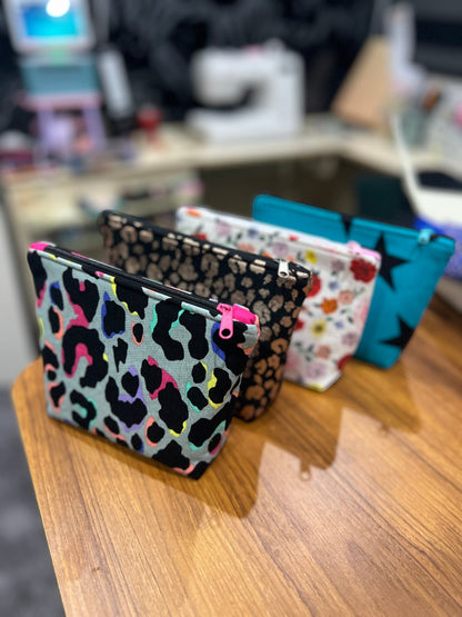 Sew Much Love black and gold leopard print mini cosmetic bag made from eco viscose with a black zip and gold pull.