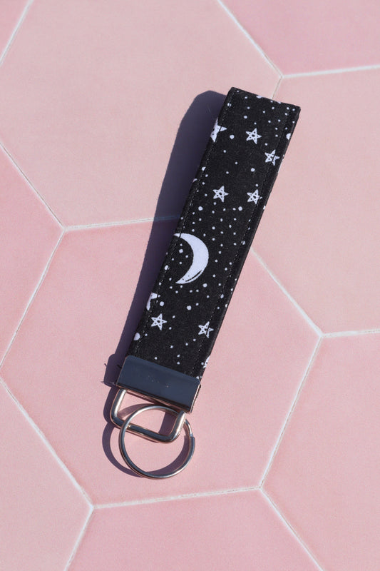 Sew Much Love black cotton wristlet keychain with white stars and moon print, silver hardware.