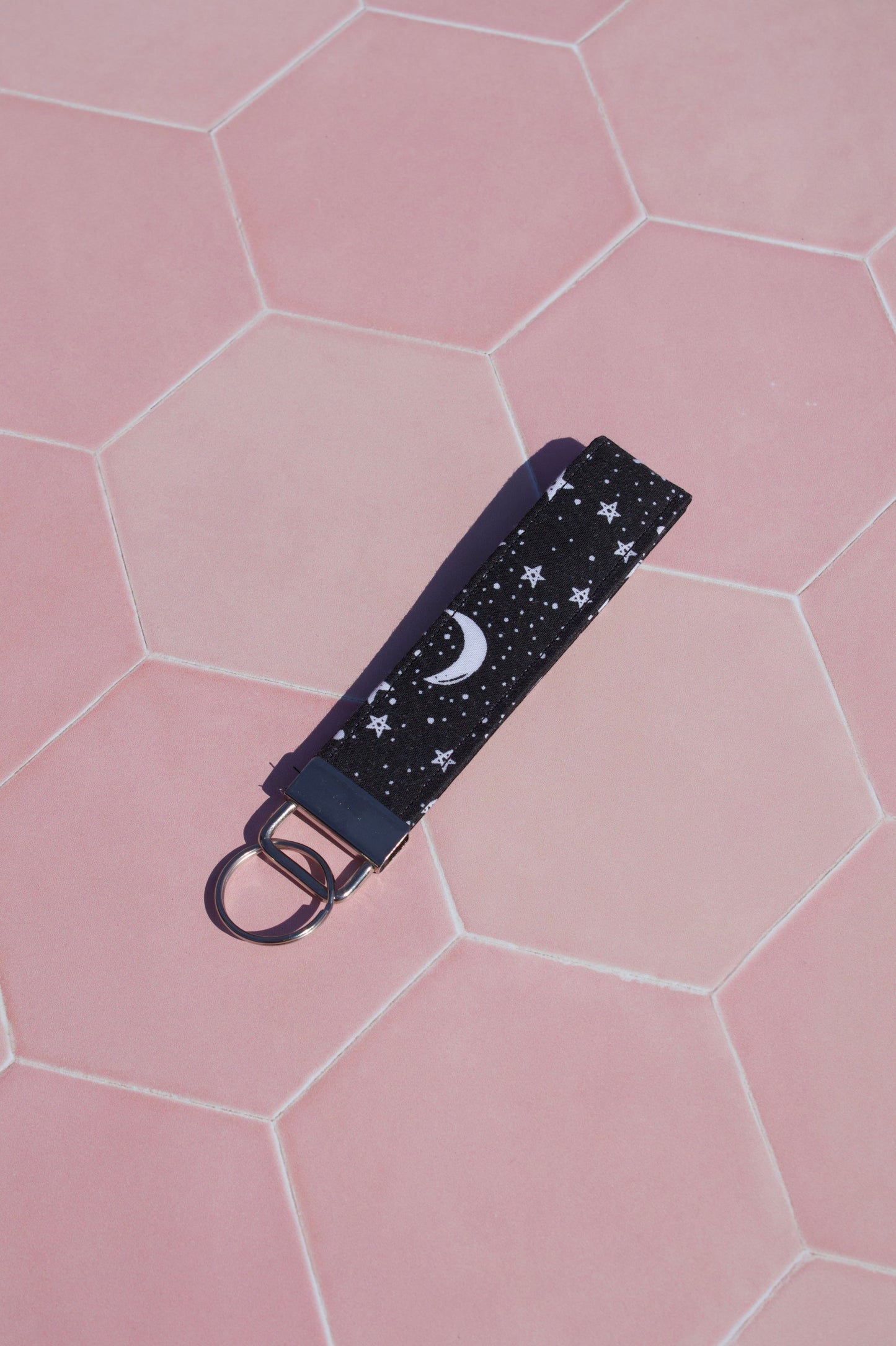 Sew Much Love black cotton wristlet keychain with white starry night print and moon detail.