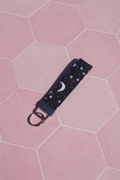 Sew Much Love black cotton wristlet keychain with white starry night print and moon detail.