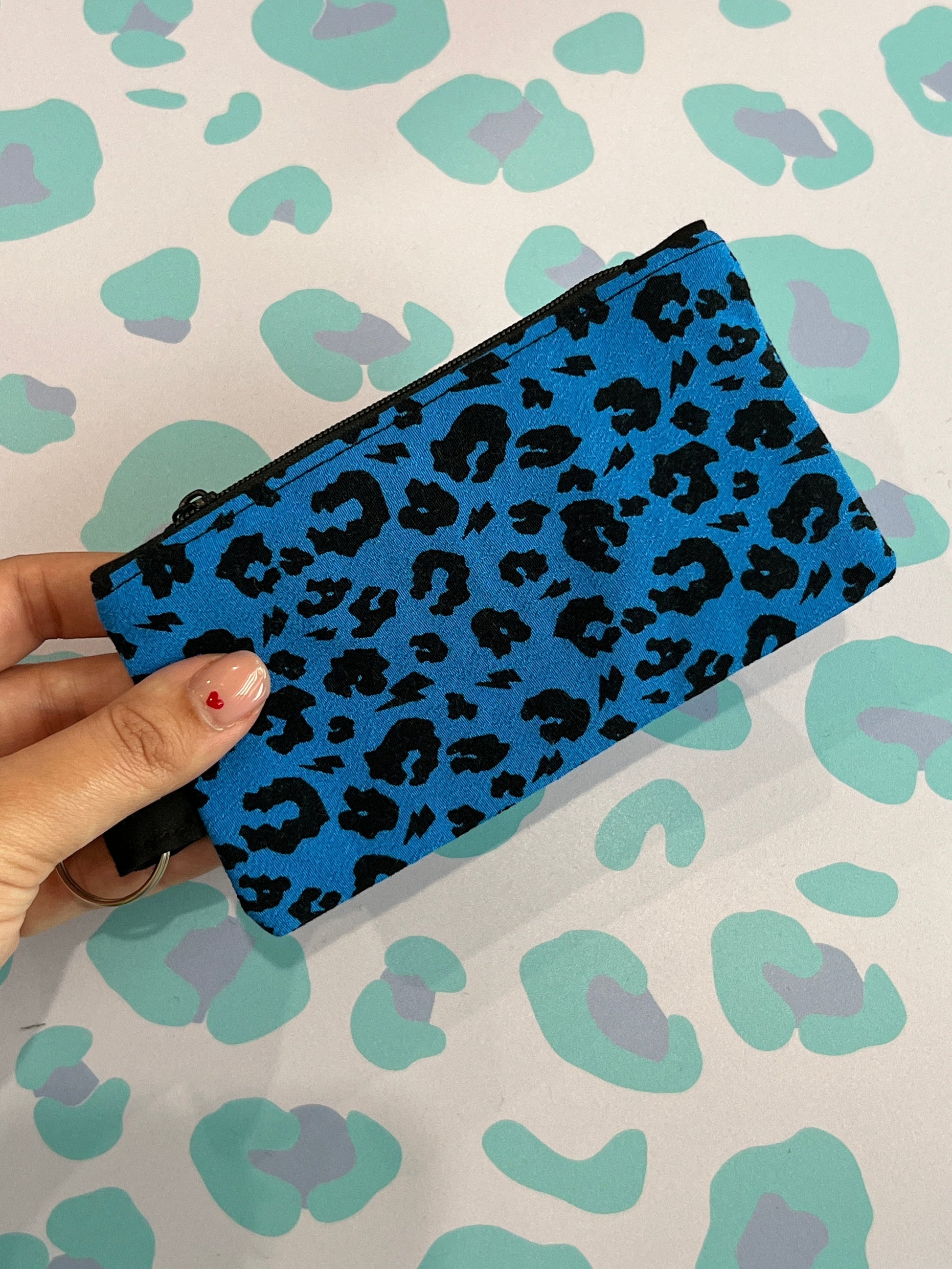 Sew Much Love blue leopard print coin purse with black zip and keyring attachment.