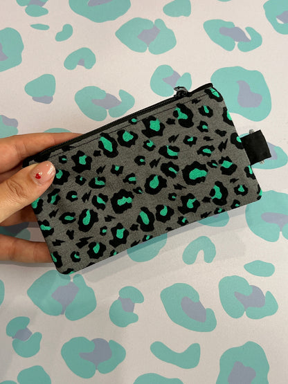 Sew Much Love grey coin purse with black and green leopard print, black zipper and keyring attachment.