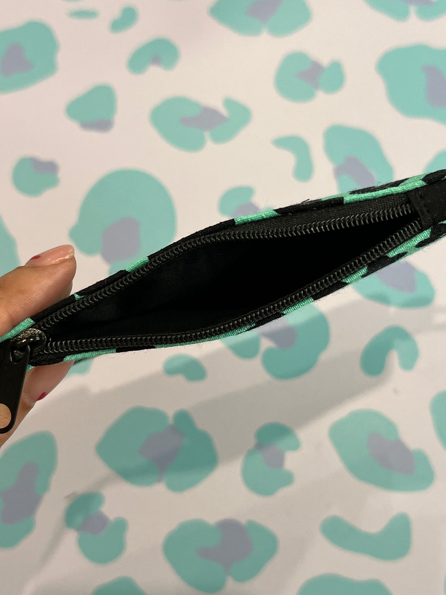 Sew Much Love limited edition leopard print coin purse with black zipper and keyring attachment. Features a bold green and black leopard pattern.