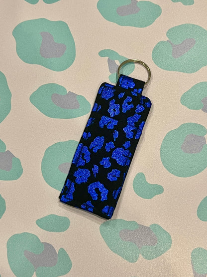 Sew Much Love black and blue metallic leopard print lip balm holder with keyring.