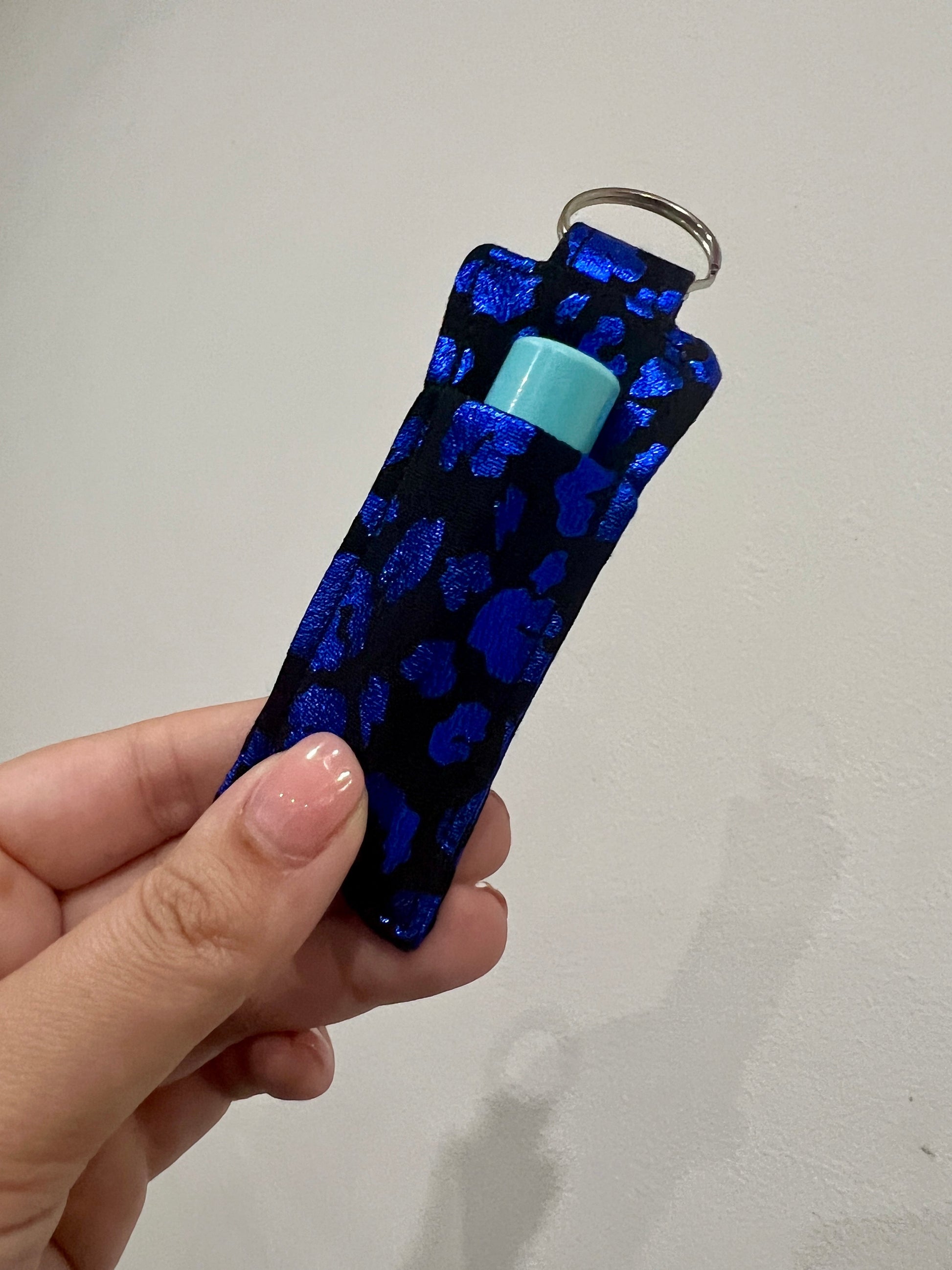 Sew Much Love black and blue metallic leopard print lip balm holder with keyring. Fits standard lip balm or lipstick.