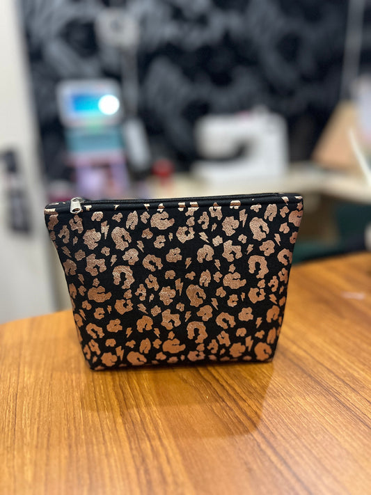 Sew Much Love black mini cosmetic bag with gold leopard print, black zip, and gold pull. Eco viscose.