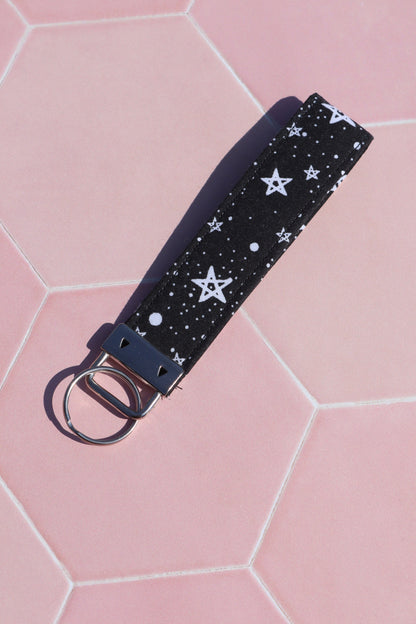 Sew Much Love black cotton wristlet keychain with white starry night print and silver hardware.