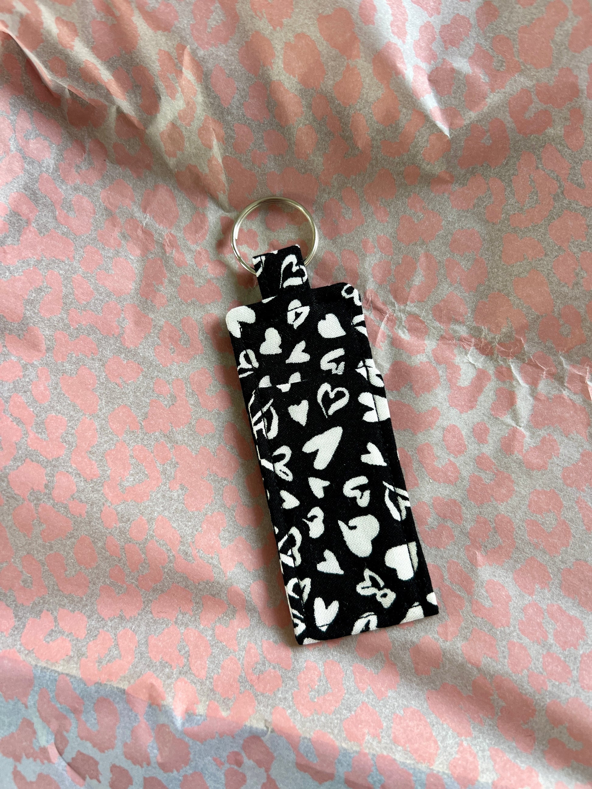 Sew Much Love black and white hearts lip balm holder with keyring, made from viscose.