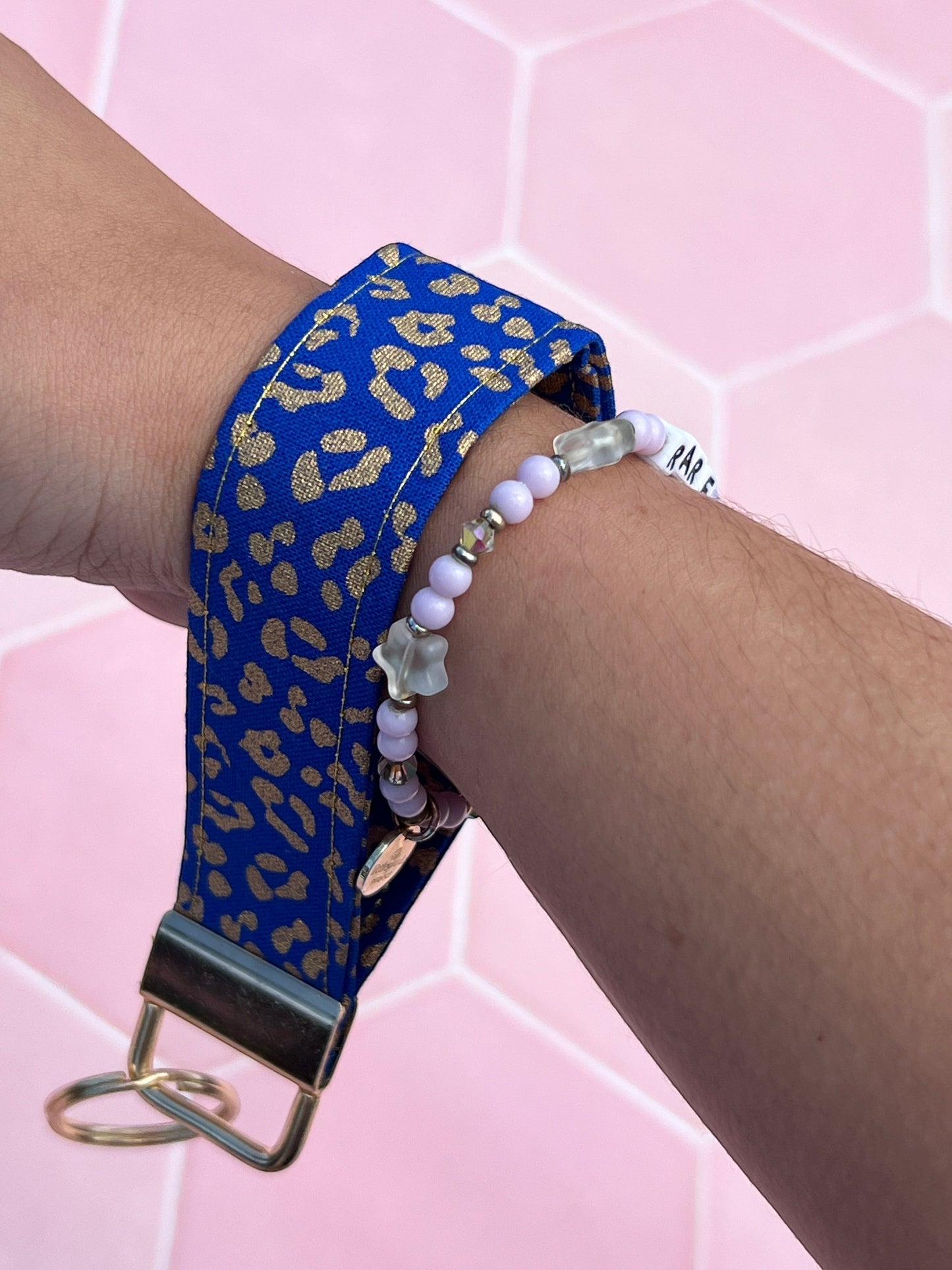 Sew Much Love blue and gold leopard print cotton wristlet keychain with gold hardware.