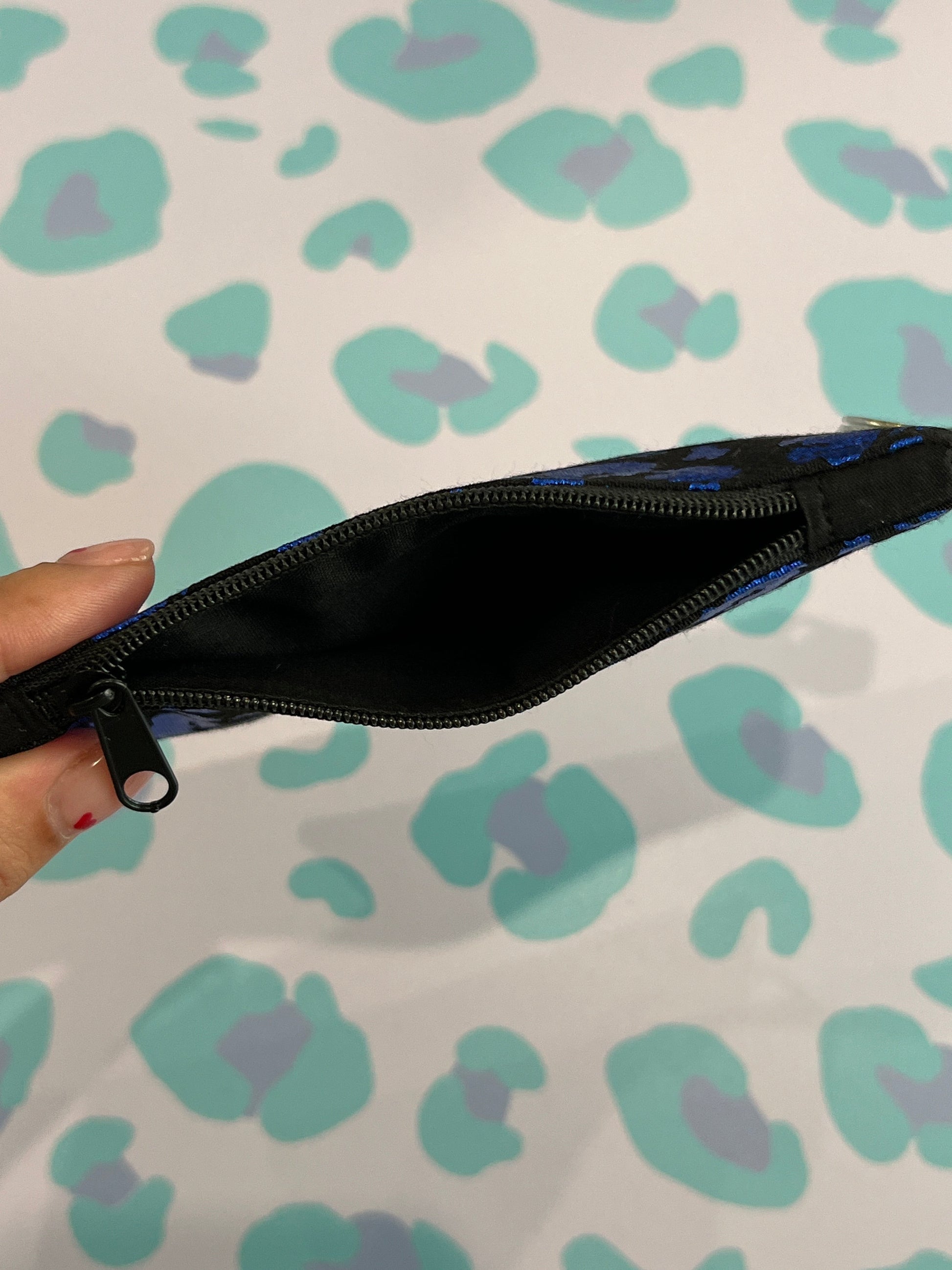 Sew Much Love blue leopard print coin purse with black zipper and keyring attachment.