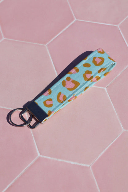 Sew Much Love blue and pink leopard print cotton wristlet keychain with silver hardware.