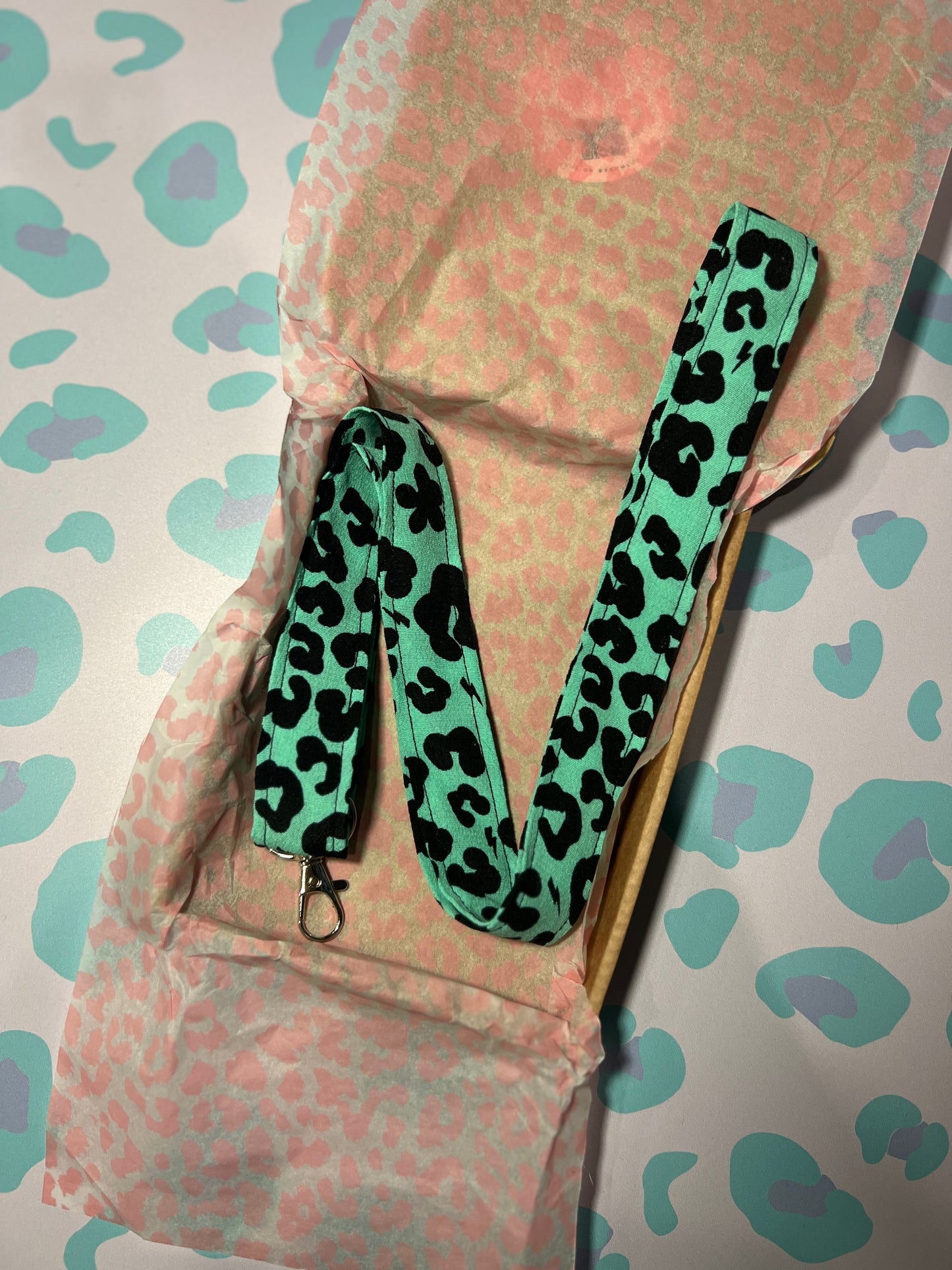 Sew Much Love green floral leopard print fabric lanyard with D-ring and swivel clasp for keys and ID badges.