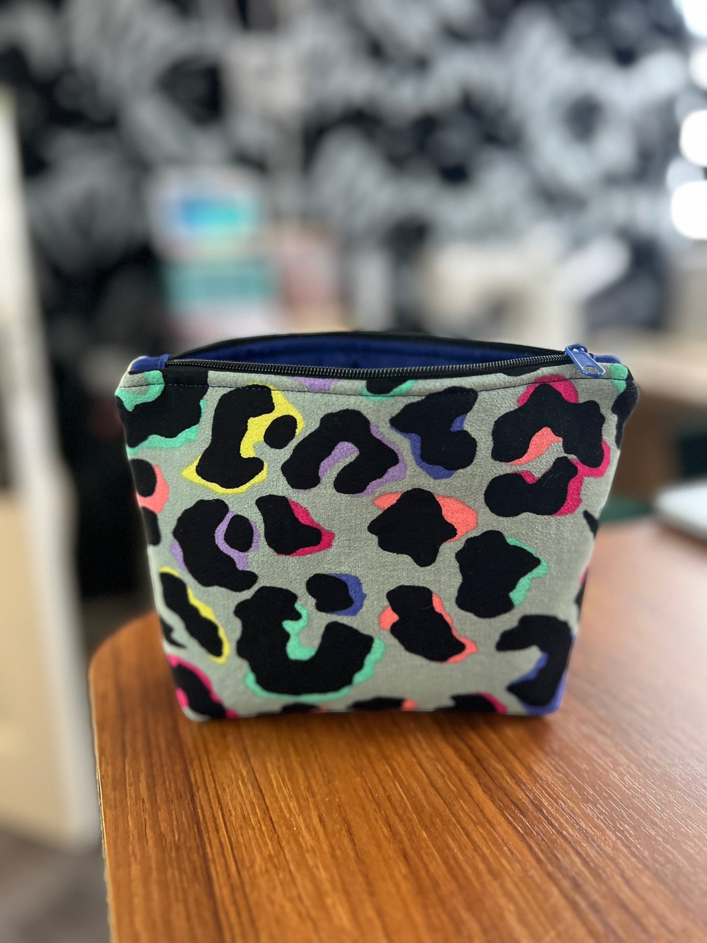 Sew Much Love khaki mini cosmetic bag with rainbow leopard print, black zip, and blue lining. Eco viscose fabric.