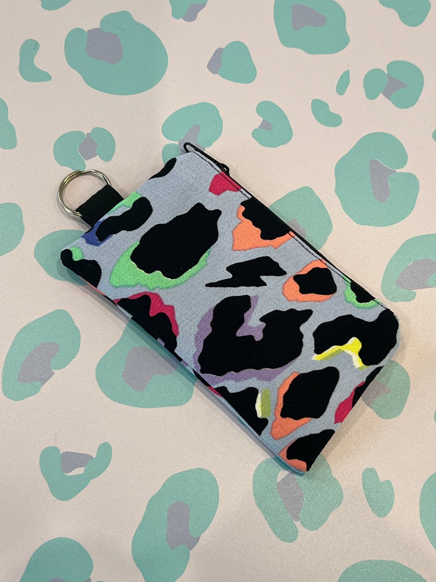 Sew Much Love light blue leopard print coin purse with black zip and keyring attachment.