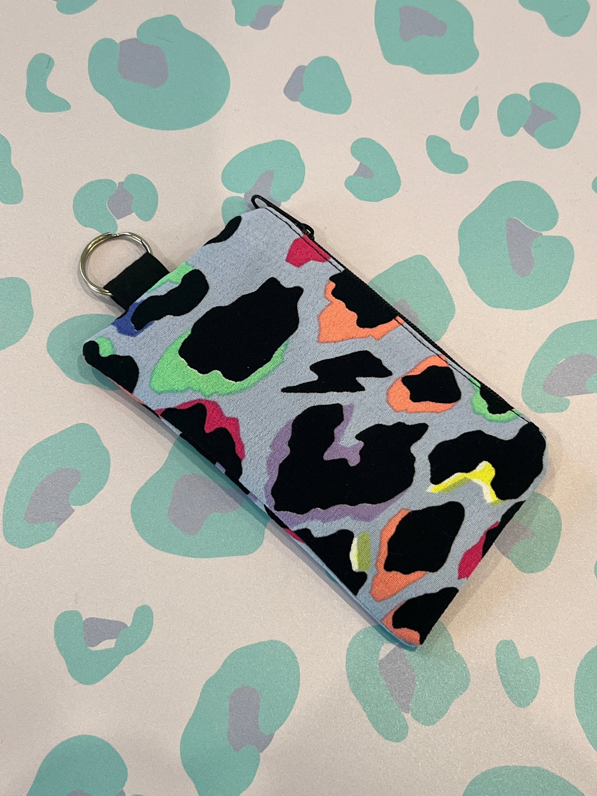 Sew Much Love light blue leopard print coin purse with black zip and keyring attachment.