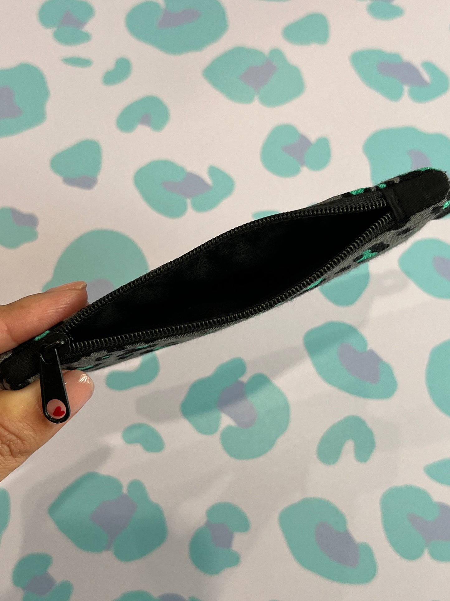 Sew Much Love grey leopard print coin purse with black zip and green accents. Handmade accessory for coins and cards.