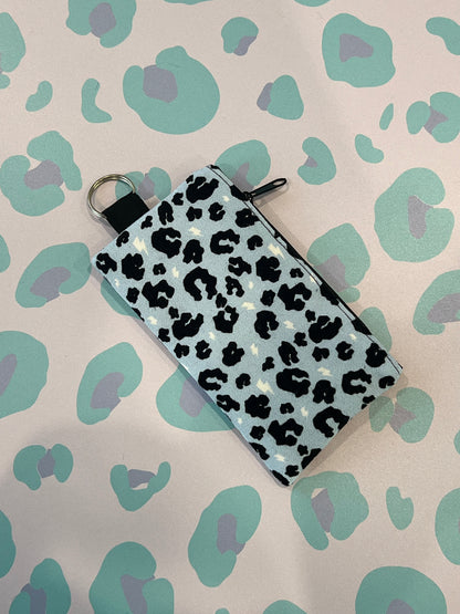 Sew Much Love light blue leopard print coin purse with black zipper and keyring attachment.