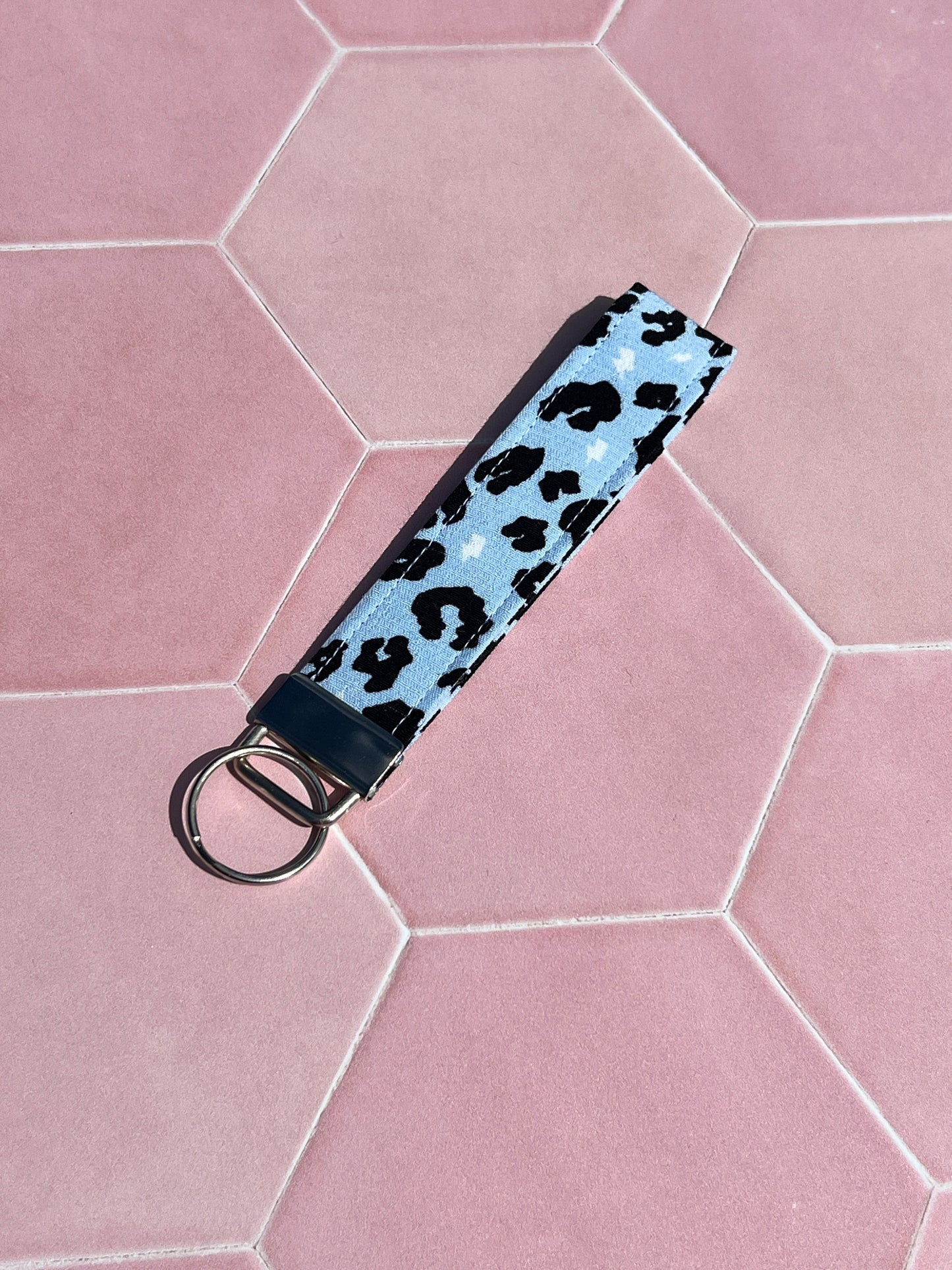 Sew Much Love light blue cotton wristlet keychain with black leopard print and silver ring.