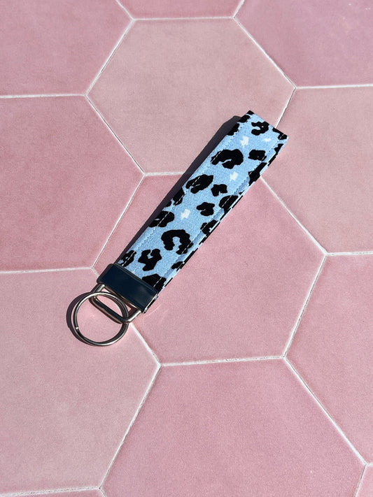 Sew Much Love light blue cotton wristlet keychain with black leopard print and silver ring.
