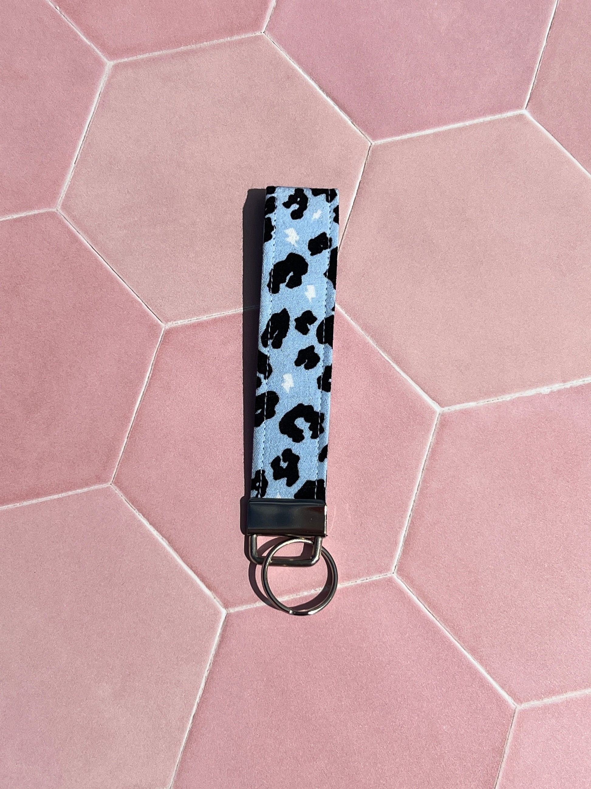 Sew Much Love light blue leopard print wristlet keychain made from eco viscose fabric with silver hardware.