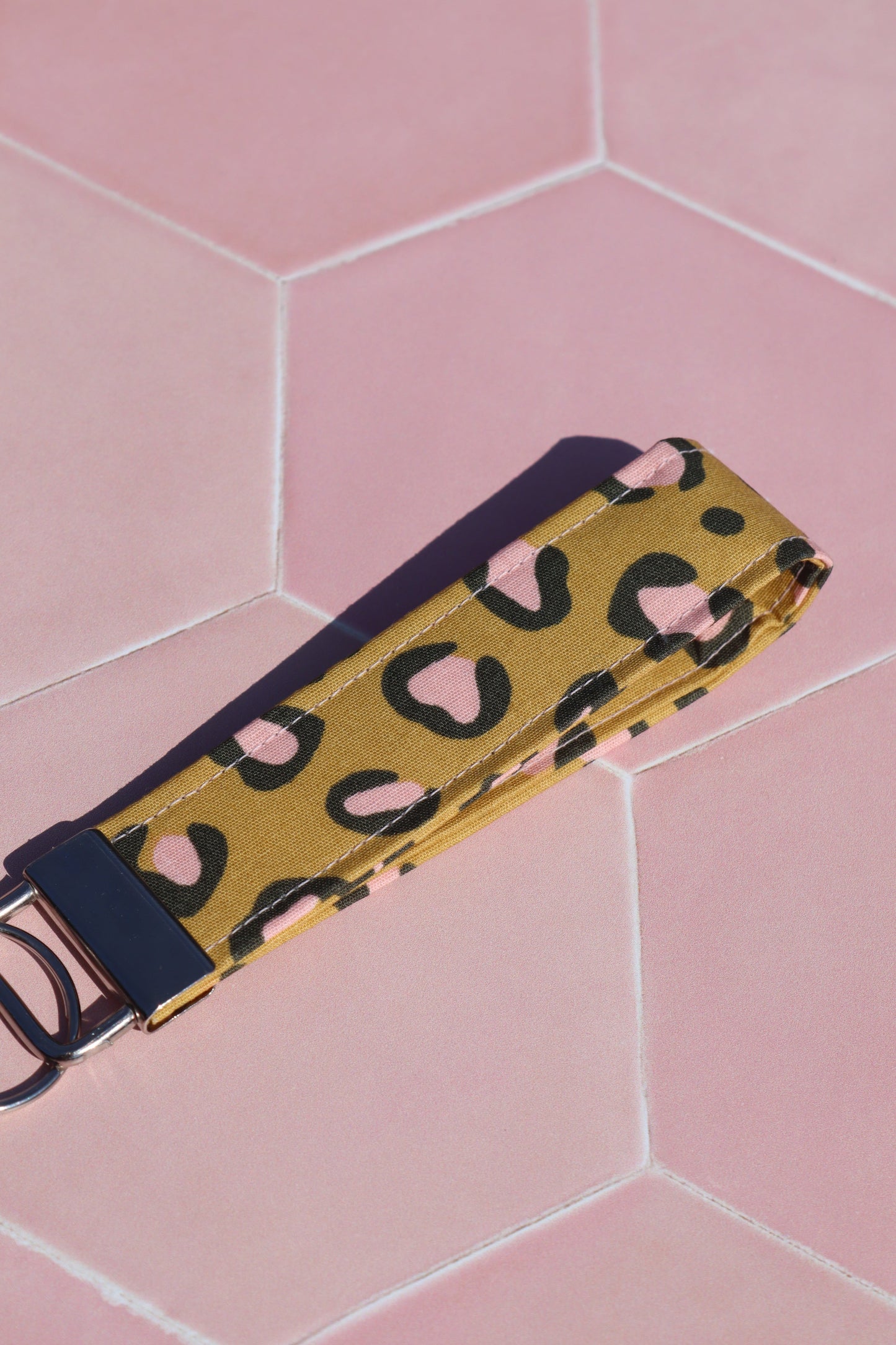 Sew Much Love mustard yellow cotton wristlet keychain with pink and black leopard print and silver hardware.