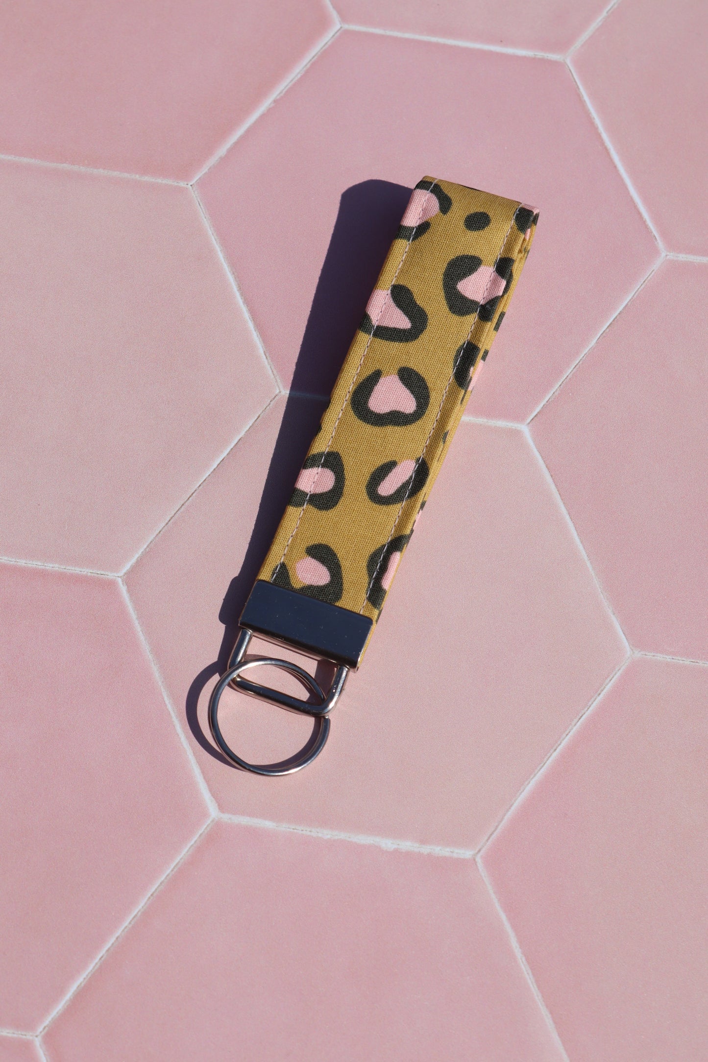 Sew Much Love mustard yellow cotton wristlet keychain with pink and black leopard print and silver hardware.
