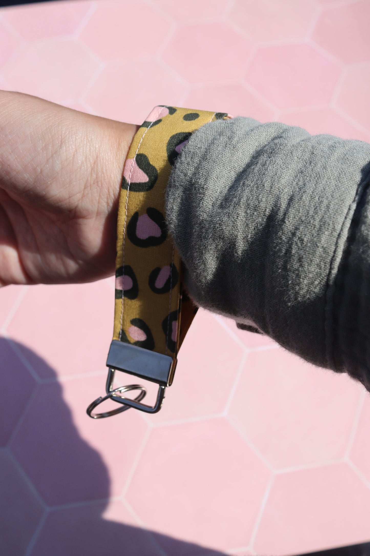 Sew Much Love mustard yellow cotton wristlet keychain with pink and black leopard print and silver hardware.