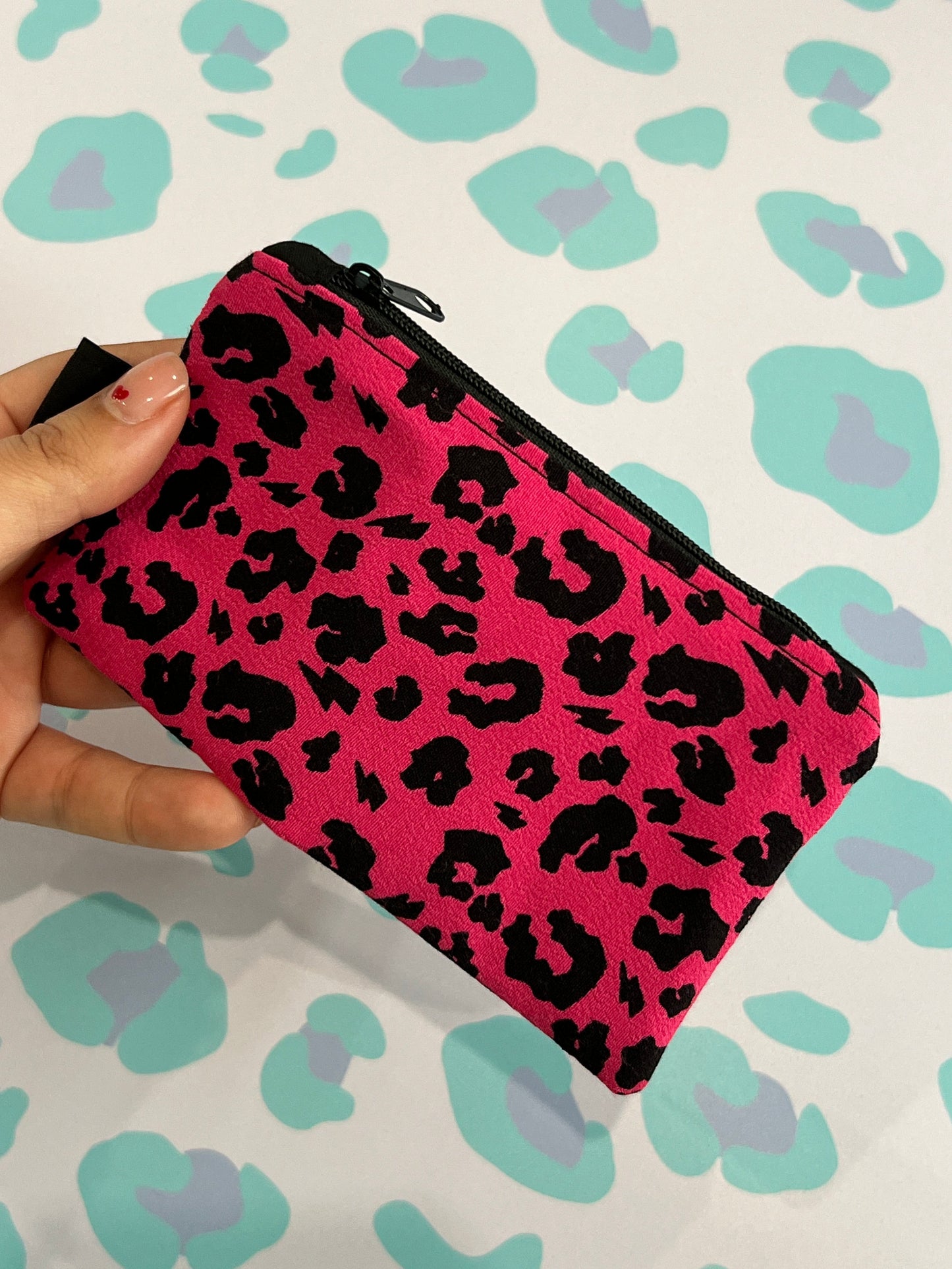 Sew Much Love handmade pink leopard print coin purse with black zipper and lining.