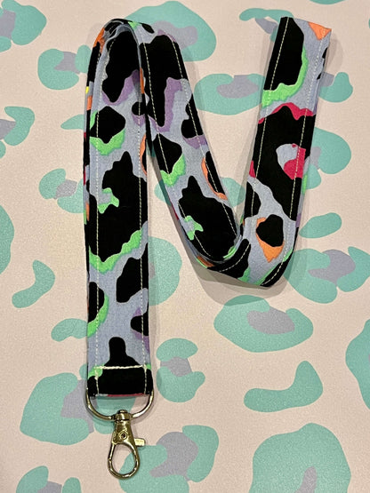 Sew Much Love light blue lanyard with a vibrant rainbow leopard print pattern and a silver clasp. Made from soft eco viscose.