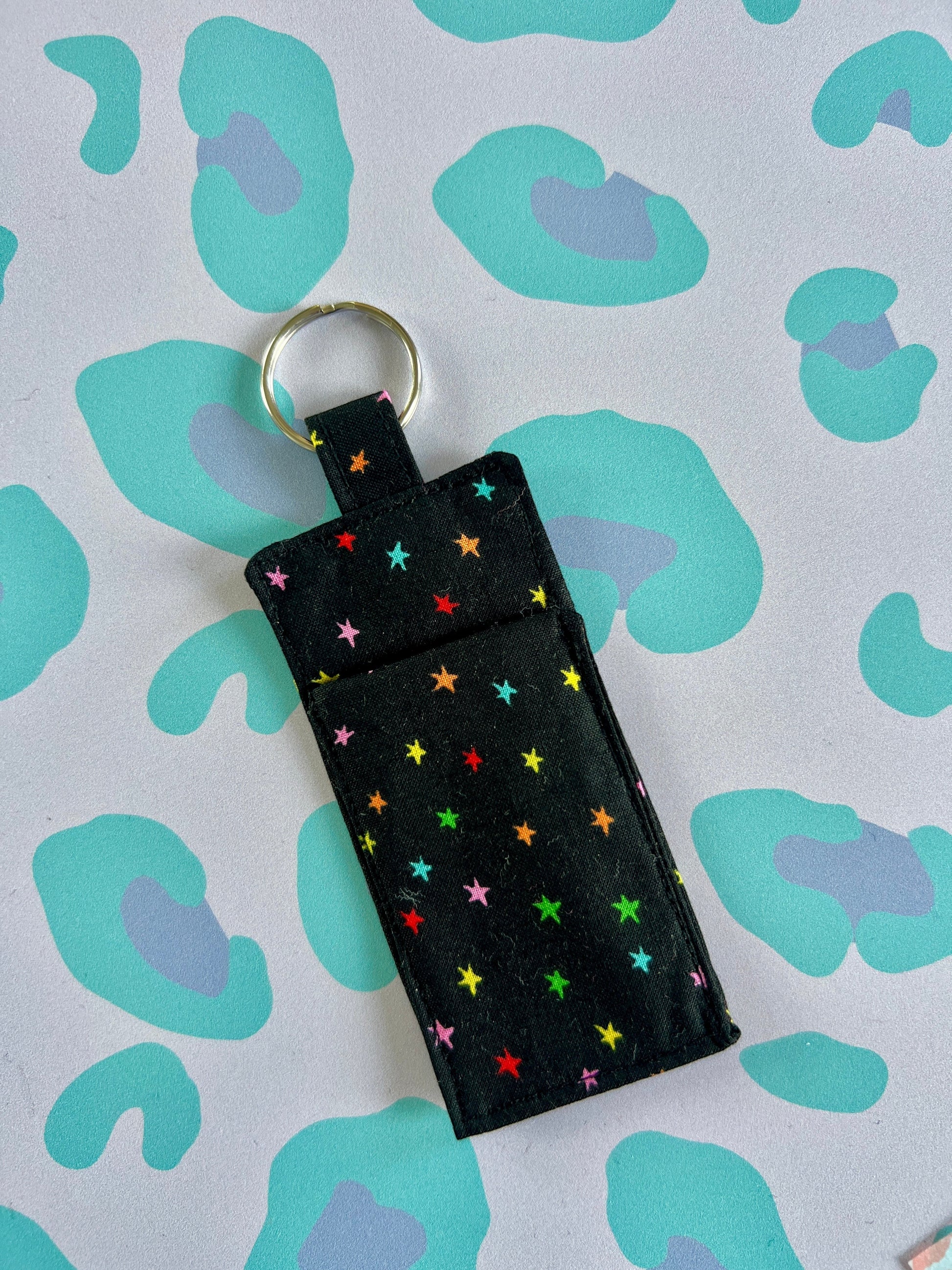 Sew Much Love black cotton lip balm holder with rainbow stars and silver keyring